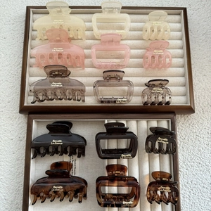 Variety of matte resin hair claw clips with gold springs in assorted colors and sizes