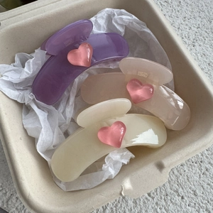 Three-piece set of heart hair claws in purple, pink, and cream colors for half-up hair