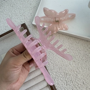 Pink translucent resin hair claw clips set featuring a sweet butterfly and minimalist design