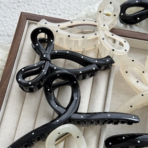 Cute Japanese style polka dot bow hair claw clips in black and creamy white resin