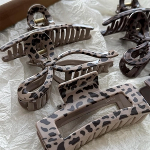 Large leopard print hair claw clips set including bow and geometric shapes
