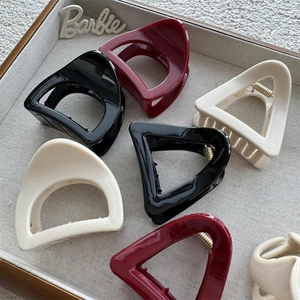 Minimalist geometric triangle hair claws in black, wine red, and cream white colors