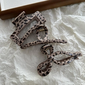 Three-piece leopard print claw clip set including square, cross, and bow resin designs