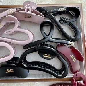 Matte finish large cloud hair claw clips in various colors with elegant gold label