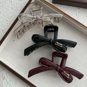 Three-piece set of elegant bow hair claws in transparent black and burgundy colors