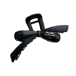 Elegant black bow hair claw clip with gold Barrette La France text on white background
