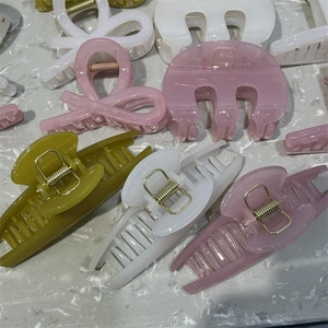 Collection of French-style thick PC hair claws in olive green, cream white and smoky pink