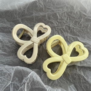 Pinze per capelli a fiocco colori pastello in resina beige crema e giallo tenue