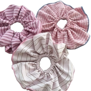 Three-piece set of pink striped oversized scrunchies with elegant pleated fabric design