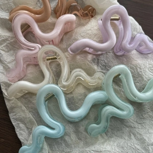 Set of six translucent wavy hair claws in pastel jelly colors for effortless hair styling