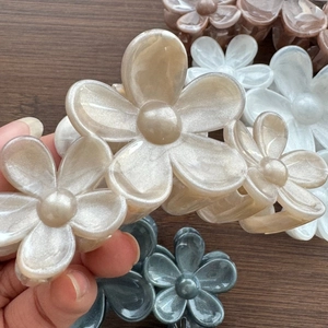 Elegant pearlescent flower hair claw clips in beige, white, grey and brown colors