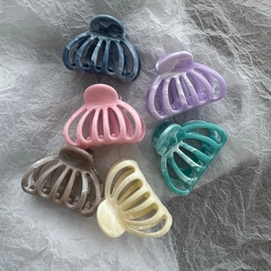 Set of 6 marble textured fan-shaped hair claws in assorted colors with hollow design