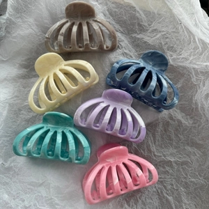 Set of six marble texture shark hair claws in assorted pastel colors for women's hair styling