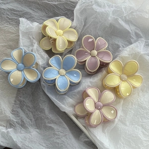 6pcs pastel candy-colored flower hair claws in macaron tones on white background