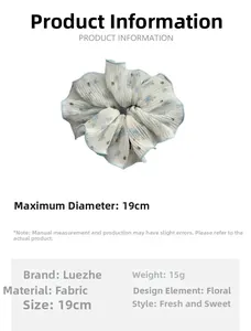 Floral fabric scrunchie detail showing 19cm diameter size and blue flower patterns