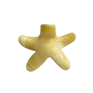 Pinza per capelli a stella marina con motivo marmorizzato giallo e finitura lucida da mare