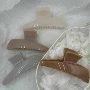 Minimalist large trapezoid hair claws in earth tones for thick hair styling