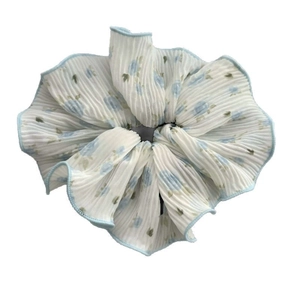 Floral double-layered scrunchie with light blue flower print and ruffled edges