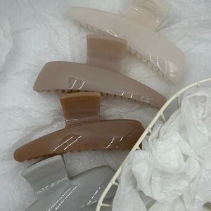 Set of 4 minimalist trapezoid hair claws in cream, brown, caramel, and grey colors