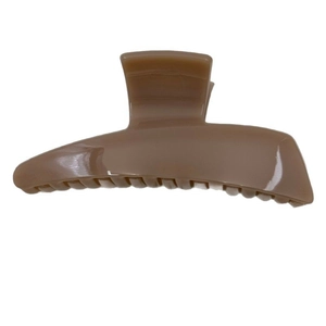 Elegant trapezoid brown hair claw clip in glossy acrylic for women's bun hairstyle