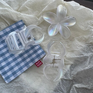 Iridescent white plumeria flower hair claw clip and crescent shark clips for women