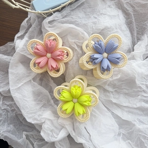 Matte tulip flower claw clips in pink, blue, and yellow with pearl-style hollow edges