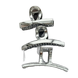 Three-piece silver metal hair claw clips set with bow and geometric designs on white background