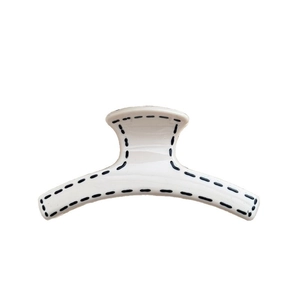 Minimalist cream white hair claw clip with black stitched edges in elegant Korean style