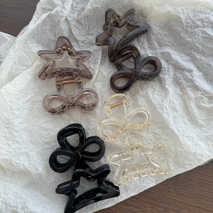 Transparent star and bow shark hair clips in assorted colors for elegant hairstyling
