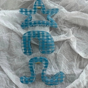 Three-piece set of light blue gingham hair claws in star, arch, and wavy shapes