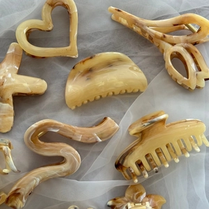 Vintage amber ink pattern hair claws in assorted shapes on soft white organza fabric