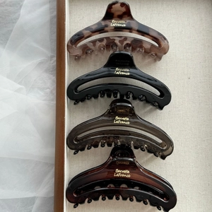 French hollow claw clips in tortoiseshell, black, smoky grey and amber brown finishes