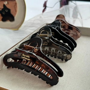 Detail of French large matte hair claw clips with gold Barrette LaFrance lettering