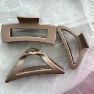 Three-piece mocha brown silicone hair claws in rectangular, semi-circle and arch shapes