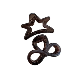 Brown transparent star and bow hair claw clips set with strong metal springs