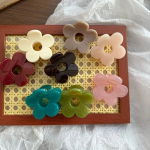 Set of 8 colorful flower hair claw clips in various matte finishes for women