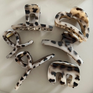Set of 6 vintage leopard print hair claws in various shapes for women's hair styling