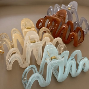 Large wavy jelly resin hair claw clips in various Morandi colors with gold metal spring
