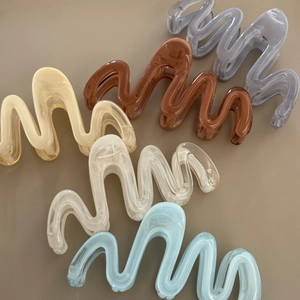 Set of 5 wavy jelly texture hair claws in cream yellow, amber brown, and pastel colors