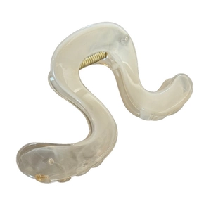Elegant cream marble patterned S-shaped hair claw clip with gold metal spring components