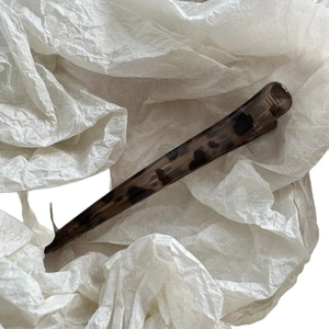 Leopard print duckbill hair clip with tortoise shell pattern in translucent grey brown