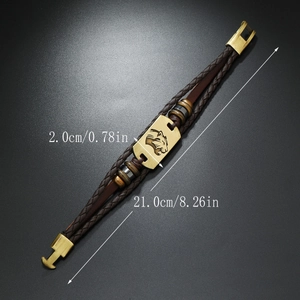 Detail view of woven leather bracelet featuring a tiger head charm and size measurements
