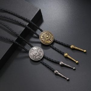 Vintage hip hop bolo tie with floral relief engraving in antique gold and silver finishes