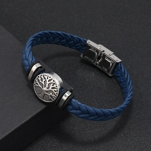 Detailed close-up of dark blue braided leather bracelet with stainless steel fold-over clasp
