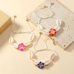 Bohemian seashell bracelet set with colorful frangipani flowers and woven cord
