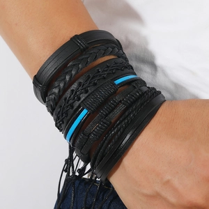 Close-up of men's multi-layer braided leather bracelets set with blue knot details