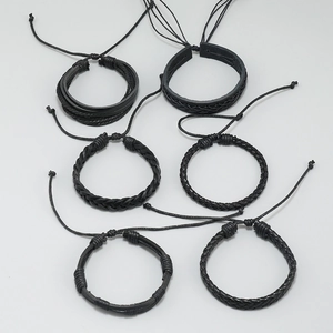 Detail of six-piece multilayer braided leather bracelet set for men with adjustable cords