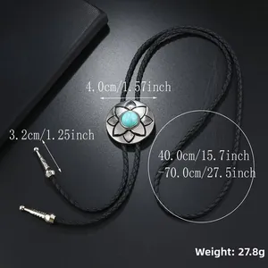 Close-up of turquoise floral bolo tie with woven leather cord and metal tips