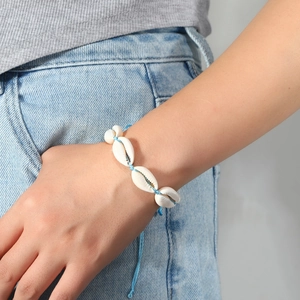 Bohemian handmade cowrie shell bracelet with adjustable blue woven cord for summer beach