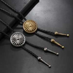 Retro sunflower bolo tie set with antique gold and silver pendants on braided leather cord